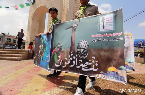 Palestinian scouts take part in a march "The Great Return March", in Rafah in the southern of Gaza strip, on Aug. 02, 2018. Photo by Abed Rahim Khatib