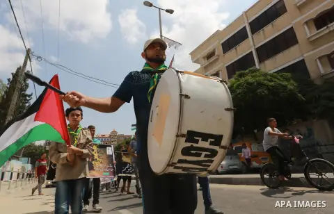 Palestinian scouts take part in a march "The Great Return March", in Rafah in the southern of Gaza strip, on Aug. 02, 2018. Photo by Abed Rahim Khatib