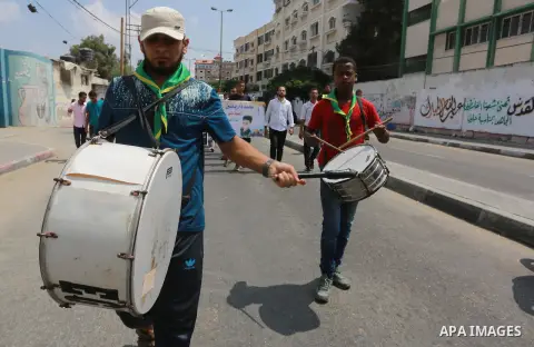 Palestinian scouts take part in a march "The Great Return March", in Rafah in the southern of Gaza strip, on Aug. 02, 2018. Photo by Abed Rahim Khatib