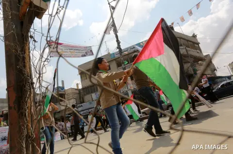 Palestinian scouts take part in a march "The Great Return March", in Rafah in the southern of Gaza strip, on Aug. 02, 2018. Photo by Abed Rahim Khatib