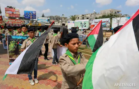 Palestinian scouts take part in a march "The Great Return March", in Rafah in the southern of Gaza strip, on Aug. 02, 2018. Photo by Abed Rahim Khatib