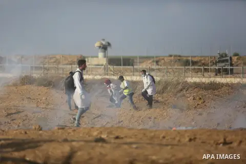Palestinian protesters gather during clashes with Israeli troops in tents protest where Palestinian demand the right to return to their homeland at the Israel-Gaza border, in Khan Younis, in the southern Gaza Strip on Au...