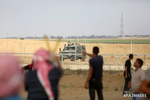 Palestinian protesters gather during clashes with Israeli troops in tents protest where Palestinian demand the right to return to their homeland at the Israel-Gaza border, in Khan Younis, in the southern Gaza Strip on Au...