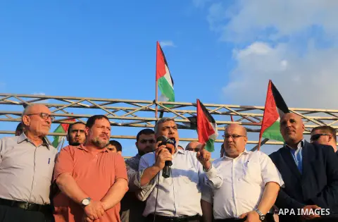 Hamas leader Izzat al-Rishq speaks during tents protest where Palestinian demand the right to return to their homeland at the Israel-Gaza border, in al-Bureij, in the center of Gaza Strip on Aug. 03, 2018. Photo by Mahmo...