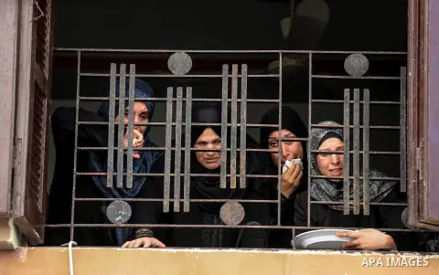 Relatives of Palestinian Ahmed Yaghi, 25, who was shot dead by Israeli troops during clashes along the border the previous day, mourn during his funeral in Gaza city on Aug. 04, 2018. Photo by Dawoud Abo Alkas