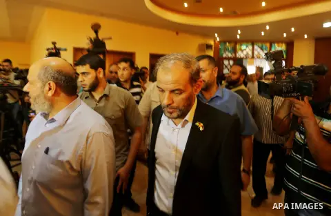 Palestinian Hamas officials Husam Badran and Khalil al-Hayya arrive for a meeting with Palestinian factions in Gaza City on August 5, 2018. Photo by Ashraf Amra
