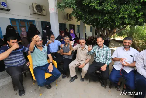 Palestinian employees of United Nations Relief and Works Agency (UNRWA) take part in a protest against a U.S. decision to cut aid, inside its offices, in Gaza City, on Aug. 07 2018. Photo by Mahmoud Khattab