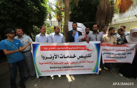 Palestinian employees of United Nations Relief and Works Agency (UNRWA) take part in a protest against a U.S. decision to cut aid, inside its offices, in Gaza City, on Aug. 07 2018. Photo by Mahmoud Khattab