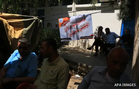 Palestinian employees of United Nations Relief and Works Agency (UNRWA) take part in a protest against a U.S. decision to cut aid, inside its offices, in Gaza City, on Aug. 07 2018. Photo by Mahmoud Khattab