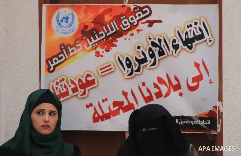 Palestinian employees of United Nations Relief and Works Agency (UNRWA) take part in a protest against a U.S. decision to cut aid, inside its offices, in Gaza City, on Aug. 07 2018. Photo by Mahmoud Khattab
