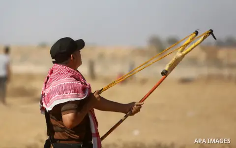 Palestinian protesters gather during clashes with Israeli troops in tents protest where Palestinians demand the right to return to their homeland at the Israel-Gaza border, in Khan Younis in the southern of Gaza Strip on...