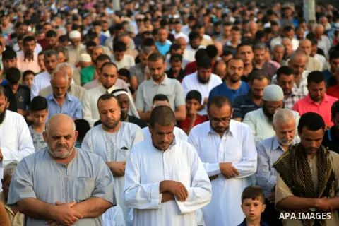 Palestinian muslims perform the prayer of Eid al-Adha or the feast of sacrifice, in al-Bureij refugee camp in the center of Gaza Strip, on August 21, 2018. Muslims around the world are celebrating Eid al-Adha, the "Feast...