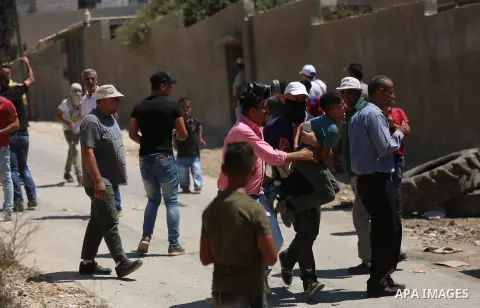 Israeli forces take position during clashes with Palestinian protesters following a weekly demonstration against the expropriation of Palestinian land by Israel in the village of Kfar Qaddum, near the West Bank city of N...