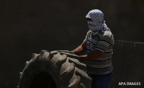 Israeli forces take position during clashes with Palestinian protesters following a weekly demonstration against the expropriation of Palestinian land by Israel in the village of Kfar Qaddum, near the West Bank city of N...