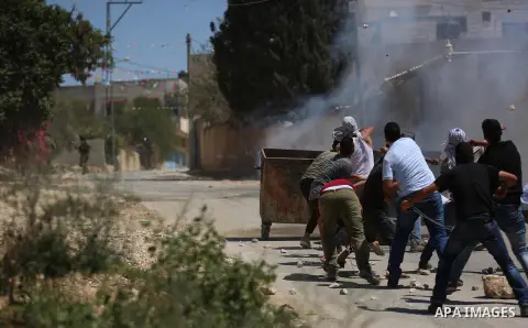 Israeli forces take position during clashes with Palestinian protesters following a weekly demonstration against the expropriation of Palestinian land by Israel in the village of Kfar Qaddum, near the West Bank city of N...