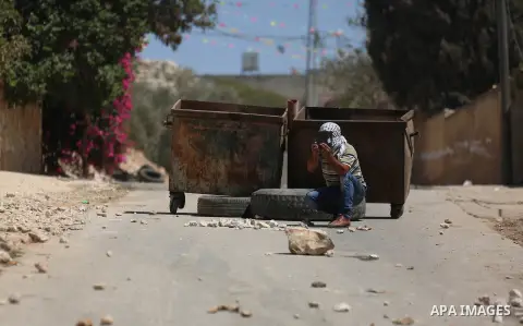 Israeli forces take position during clashes with Palestinian protesters following a weekly demonstration against the expropriation of Palestinian land by Israel in the village of Kfar Qaddum, near the West Bank city of N...