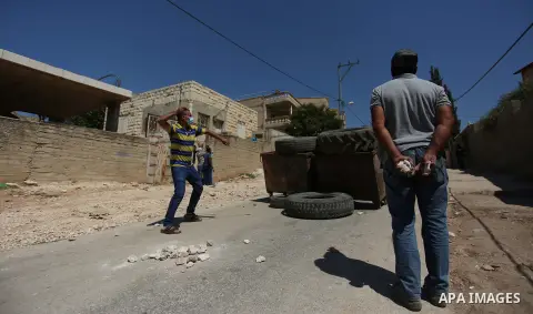 Israeli forces take position during clashes with Palestinian protesters following a weekly demonstration against the expropriation of Palestinian land by Israel in the village of Kfar Qaddum, near the West Bank city of N...