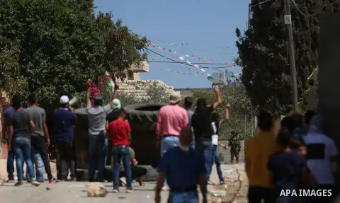 Israeli forces take position during clashes with Palestinian protesters following a weekly demonstration against the expropriation of Palestinian land by Israel in the village of Kfar Qaddum, near the West Bank city of N...