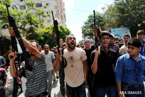 Mourners carry the body of Palestinian Belal Khafaja, 17, who was shot dead by Israeli troops during clashes in tents protest at the Israel-Gaza border, during his funeral in Rafah in the southern Gaza Strip on September...