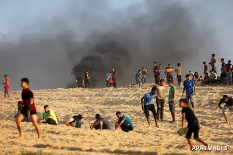 Palestinian protesters gather during a demonstration against the Israeli blockade on Gaza Strip, along the Gaza sea barrier on the maritime border with Israel near Kibbutz Zikim, north of Beit Lahia in the northern Gaza...