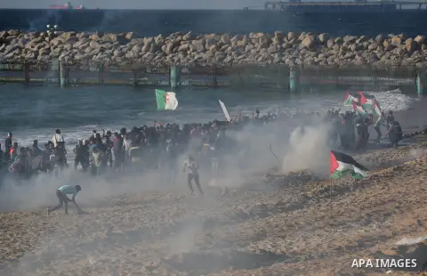 Palestinian protesters gather during clashes with Israeli forces in a demonstration against the Israeli blockade on Gaza Strip, along the Gaza sea barrier on the maritime border with Israel near Kibbutz Zikim, north of B...