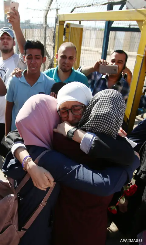 Palestinian student Ola Marshoud is greeted by relatives and friends at the Israeli checkpoint of Al-Jalameh, south of the West Bank city of Jenin following her release from an Israeli jail on September 20, 2018 after se...