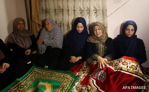 Relatives of Palestinian Kareem Kullab, 25, who was shot dead by Israeli forces during clashes in tents protest where Palestinians demand the right to return to their homeland at the Israel-Gaza border, mourn during his...