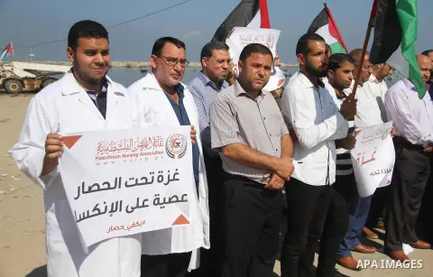 Palestinian members of the National Commission to break the siege, attend a press conference at the seaport in Gaza city on September 23, 2018. Photo by Mahmoud Ajour