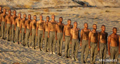 Palestinian students show off their military skills during a training at al-Rebat College for Law and Police Science in Khan Younis in the southern of Gaza Strip, on September 23, 2018. Photo by Atia Darwish