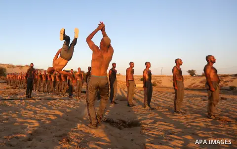 Palestinian students show off their military skills during a training at al-Rebat College for Law and Police Science in Khan Younis in the southern of Gaza Strip, on September 23, 2018. Photo by Atia Darwish
