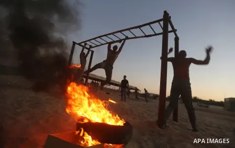 Palestinian students show off their military skills during a training at al-Rebat College for Law and Police Science in Khan Younis in the southern of Gaza Strip, on September 23, 2018. Photo by Atia Darwish