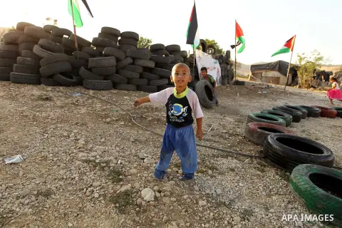 Palestinian protesters and Activists gather at the Bedouin village of Khan al-Ahmar, in the occupied West Bank against Israel's plan to demolish the village on September 27, 2018. Photo by Wisam Hashlamoun