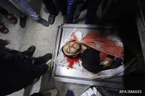 Relatives of Palestinian Mohammed Shakhsa, 24, who was shot dead by Israeli forces during clashes in tents protest where Palestinians demand the right to return to their homeland at the Israel-Gaza border, mourn over his...