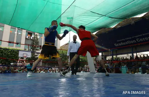 Palestinian fighters compete during the first individual boxing tournament at the University College of Applied Sciences "UCAS" in Gaza city, on September 30, 2018. Photo by Mahmoud Ajjour