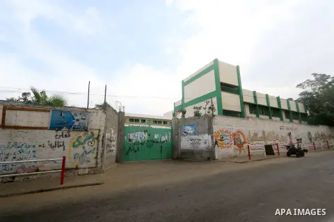 Palestinians walk past a closed school during a general strike against Israel's Nation State Law, in Dair al-Balah in the center of Gaza Strip on October 1, 2018. The recently-passed Israel's Nation State Law, declares t...