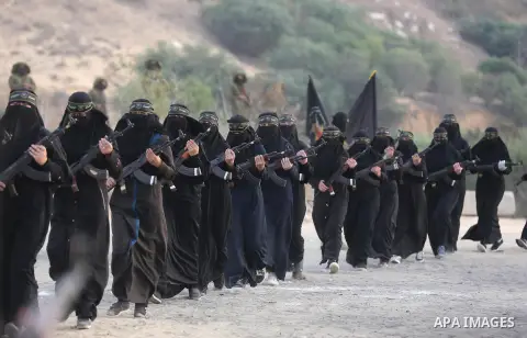Palestinian Female members of al-Quds brigades, the military wing of Jihad Islamic organisation, Show their combat skills during a military show in Khan Yunis at southern Gaza Strip, on Oct. 6, 2018. Photo by Ashraf Amra