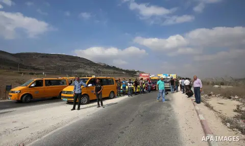 Palrstinians wait as Israeli security forces inspect their cars at the Huwwara checkpoint, south of the northern occupied West Bank city of Nablus on October 11, 2018. According to Hebrew-language news outlets, that an I...