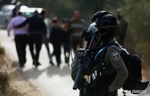 Israeli soldiers take position during clashes with Palestinian order to shut down a Palestinian school in the West Bank city of Nablus, on October 15, 2018. Photo by Shadi Jarar'ah