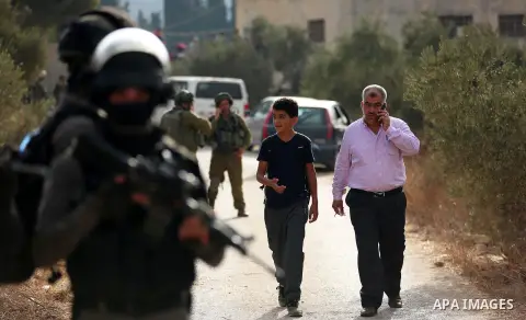 Palestinians clash with Israeli soldiers over an Israeli order to shut down a Palestinian school in the West Bank city of Nablus, on October 15, 2018. Photo by Shadi Jarar'ah