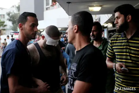 A Palestinian protester who was wounded during clashes with Israeli froces at the Israel-Gaza border, arrives to al-Shifa hospital to receive treatment in Gaza city on October 19, 2018. Photo by Mahmoud Ajjour