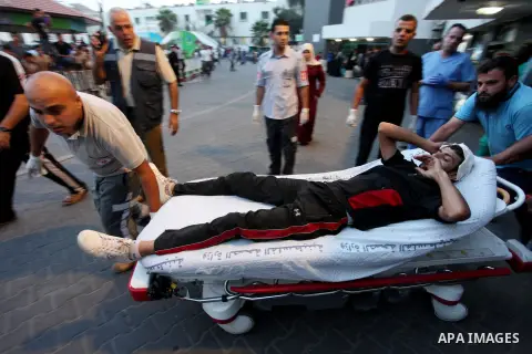 A Palestinian protester who was wounded during clashes with Israeli froces at the Israel-Gaza border, is carried on stretcher as he arrives to al-Shifa hospital to receive treatment in Gaza city on October 19, 2018. Phot...