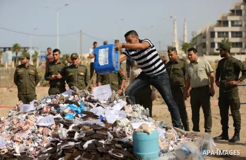 Members of Palestinian anti-drug police burn drugs during the annual conference for the destruction of narcotics, in Gaza City on October 22, 2018. Photo by Ashraf Amra