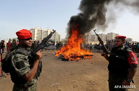 Members of Palestinian anti-drug police burn drugs during the annual conference for the destruction of narcotics, in Gaza City on October 22, 2018. Photo by Ashraf Amra