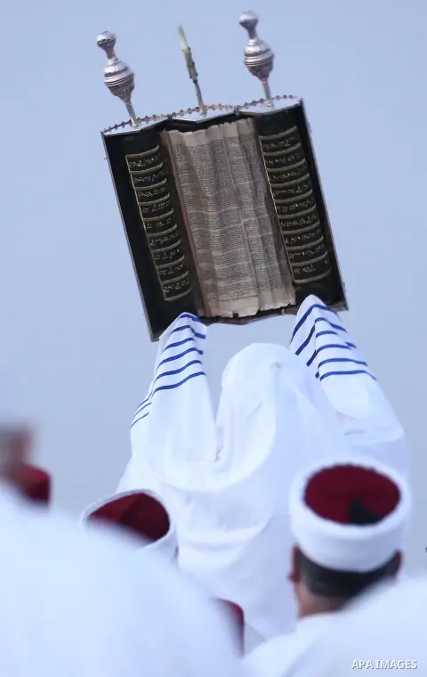 Samaritans pray on top of Mount Gerizim near the northern West Bank city of Nablus on October 23, 2017 during the holiday of Sukkot (Tabernacles) celebrations. Sukkot marks the exodus of the ancient Hebrew people from Eg...