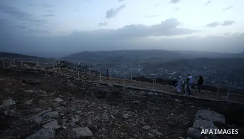 Samaritans pray on top of Mount Gerizim near the northern West Bank city of Nablus on October 23, 2017 during the holiday of Sukkot (Tabernacles) celebrations. Sukkot marks the exodus of the ancient Hebrew people from Eg...