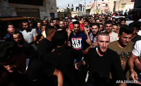 Mourners carry the body of Palestinian man Mohammed Basharat,22, during his funeral in the village of Taamun near Jenin in the occupied West Bank on October 24, 2018. Photo by Shadi Jarar'ah