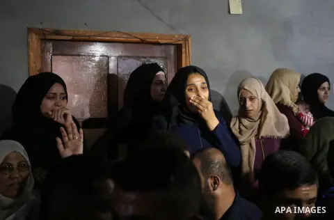 Relatives of Palestinian Muntaser al-Baz, who was shot dead by Israeli forces during a protest at the Israel-Gaza border, mourn during his funeral in Dair Al Balah in the central Gaza Strip, on October 24, 2018. Photo by...