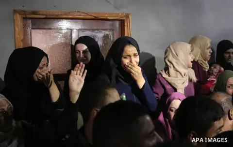 Relatives of Palestinian Muntaser al-Baz, who was shot dead by Israeli forces during a protest at the Israel-Gaza border, mourn during his funeral in Dair Al Balah in the central Gaza Strip, on October 24, 2018. Photo by...