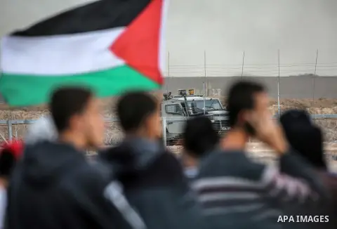 Palestinian protesters gather during clashes with Israeli troops in tents protest where Palestinians demand the right to return to their homeland at the Israel-Gaza border, in east of Gaza City on October 26, 2018. Photo...