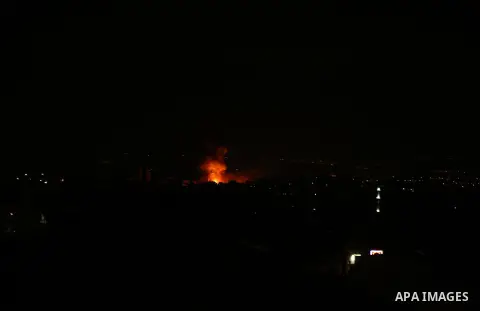 A picture taken on on October 27, 2018 shows a fireball exploding during Israeli air strikes in Gaza City. Photo by Dawoud Abo Alkas